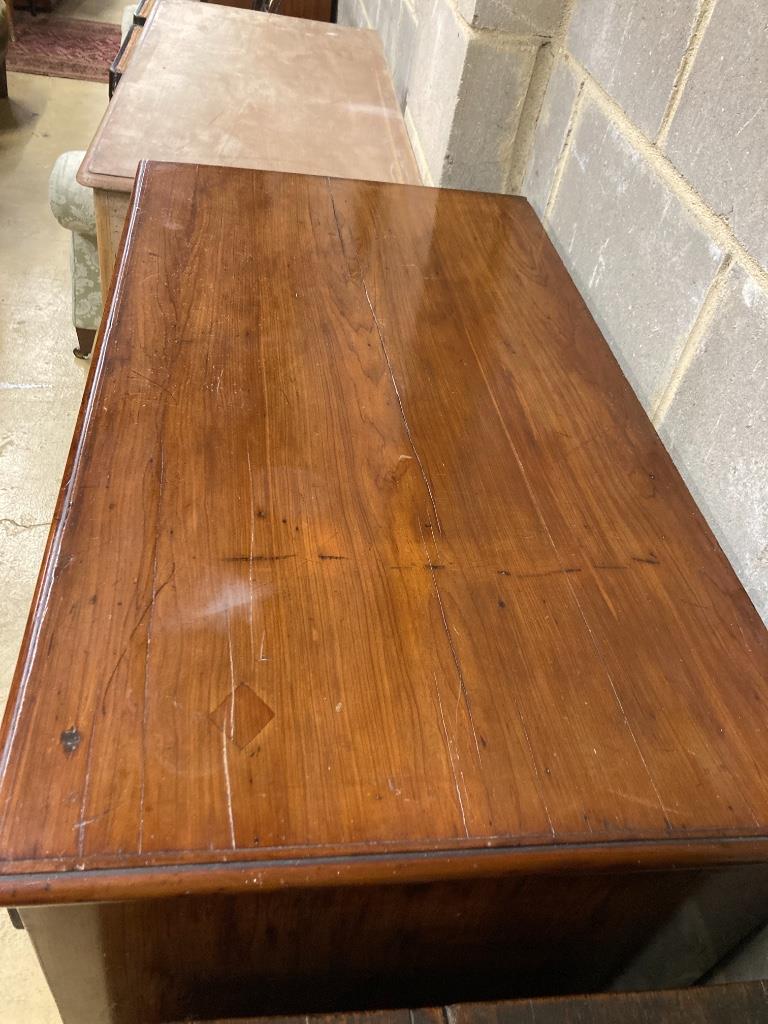 An early 19th century two part fruitwood chest